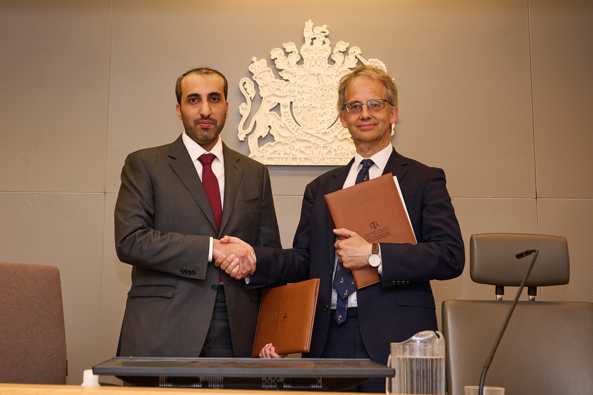 Faisal Al Sahouti, QICDRC CEO, signs MOG with the Commercial Court of England and Wales